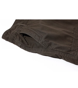 Close-up of durable dark brown cargo shorts showing reinforced stitching and belt loops