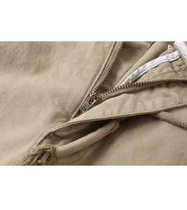 Detail of khaki twill cotton fabric with high-quality metal zipper and precision stitching