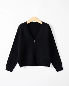 Detail view of a black V-neck knit cardigan with three buttons on a wooden hanger