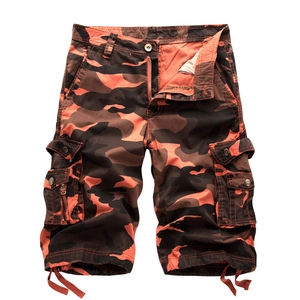 Men's loose cargo camouflage shorts with orange jungle pattern and multiple utility pockets