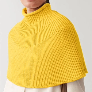 Bright yellow high neck ribbed knit capelet poncho for women shown on model