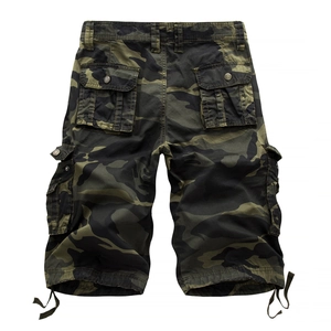 Detailed view of cargo camo shorts featuring functional flap pockets and drawstring hems