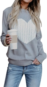 Detail of grey crewneck knit sweater featuring a textured white heart intarsia pattern