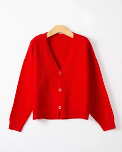Close-up of red V-neck knit cardigan with three matching round buttons and soft texture
