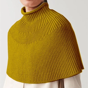 Detailed view of ginger yellow ribbed knit turtleneck dickey collar and neck warmer