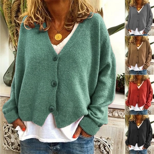 Macro shot of V-neck knitted cardigans in various colors with high-quality buttons
