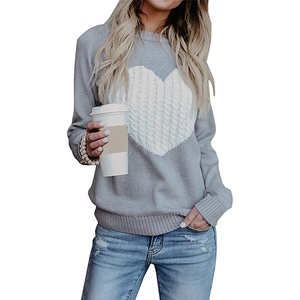 Light gray knitted sweater with a bold white cable knit heart design and ribbed round neck