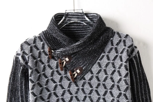 Close-up of men's turtleneck knit sweater with wooden toggle buttons and leather details