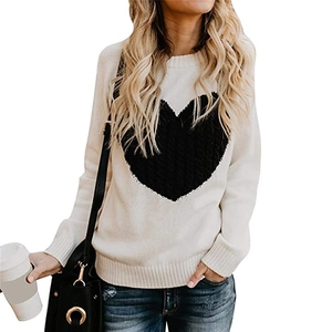 Casual cream knit sweater with large black heart pattern and ribbed crewneck design