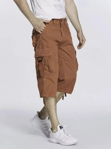 Men's rust red cargo capri pants with large side flap pockets in loose fit outdoor style