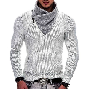 Detail of light grey knit sweater featuring high overlap collar and zipper pocket