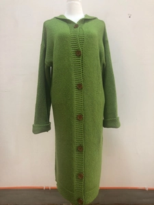 Detail of chunky knit hooded cardigan with brown buttons and rolled cuffs in grass green