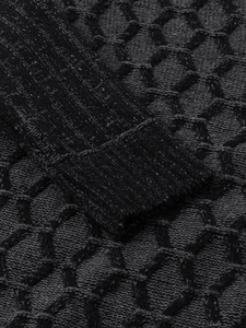 Macro shot of high-quality knit honeycomb texture and ribbed cuffs on men sweater