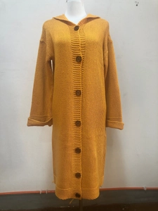 Detail showing ginger yellow long knitted hooded cardigan with chunky knit texture and buttons