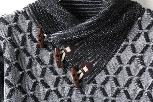 Detail of high neck knit sweater with leather buckle and diamond pattern texture