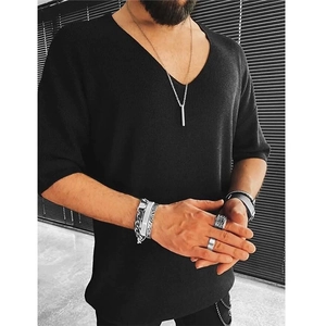 Detailed close-up of a men's black V-neck short-sleeved knitted shirt with ribbed texture