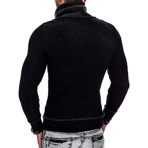 Close-up of black high-neck sweater showing thick knit texture and vertical ribbing
