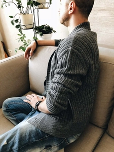 Detail of grey men's knit cardigan showing textured vertical stripe pattern and stand collar