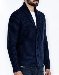Detail of navy knit cardigan featuring a classic shawl collar and ribbed texture