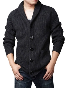 Detail of dark grey knit cardigan with shawl collar and vertical ribbed texture