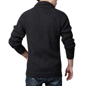Detail of the men's charcoal knitted sweater with thick ribbed texture and back seam