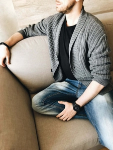 Close-up of grey shawl collar knit cardigan with rib texture and button detail