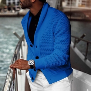 Detail of blue men's shawl collar cardigan showing waffle knit texture and buttons