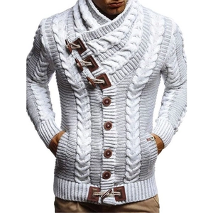 Close-up of chunky cable-knit texture and vintage toggle buttons on men's gray cardigan