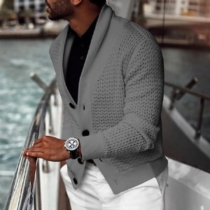 Close-up of grey knit cardigan featuring large buttons and premium shawl collar detail