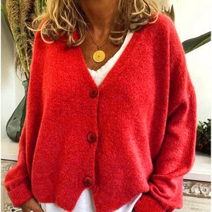 Women's bright red V-neck knit cardigan sweater with buttons and relaxed fit design