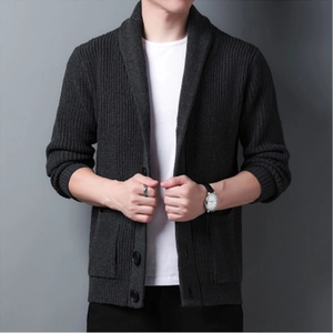 Detail of men's dark grey chunky knit cardigan with shawl collar and large pockets