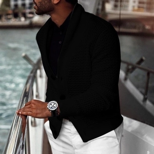 Detail of men's black knit cardigan featuring a shawl collar and ribbed texture finish