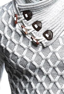 Detail of grey honeycomb knit sweater with wooden toggle buttons and leather patches