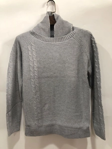 Close-up of grey slim fit sweater featuring honeycomb and cable knit pattern texture