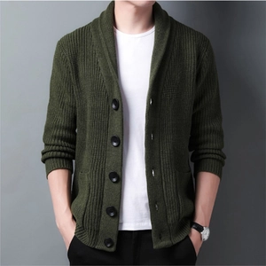 Detailed view of dark green shawl collar cardigan featuring ribbed texture and large buttons