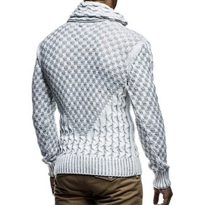 Detail view of men's turtle neck knit sweater featuring cable and waffle knit textures