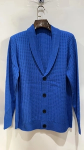 Detail showing the elegant shawl collar and waffle knit texture on this men's blue cardigan