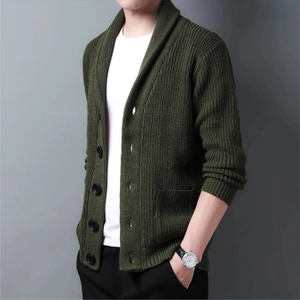 Detailed view of dark green shawl collar knit cardigan with large buttons and ribbed cuffs