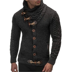 Detail of dark grey knit cardigan with high neck, cable stitch and horn buttons
