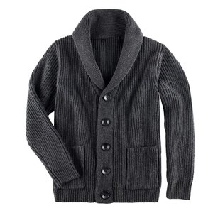 Detail of dark grey shawl collar cardigan featuring rib-knit texture and front pockets