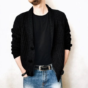 Men's casual black cable knit cardigan with buttons styled with jeans and a T-shirt