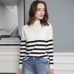 Detail of soft striped knit texture and turtleneck collar on a women long sleeve sweater
