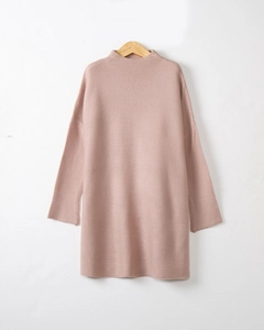 Detail of high neck knitted dress in lotus pink with dropped shoulder and dense texture
