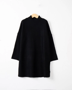 Detail of a black long-sleeve knit sweater dress with a mock neck on a wooden hanger