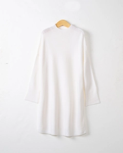 Vertical view of white long-sleeve knit dress with round neck hanging on wooden hanger