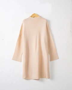 Detail view of beige knit dress texture with a round neck and drop shoulder design