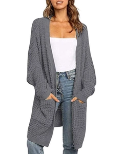 Close-up of chunky honeycomb knit texture and front pockets on this grey cardigan