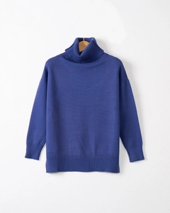 Detailed close-up of premium royal blue knit sweater featuring ribbed collar and cuff texture
