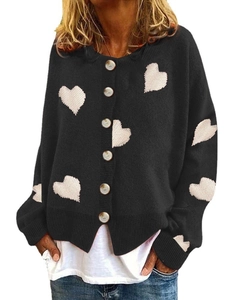 Women's black knit cardigan with white heart patterns and button closure in a loose fit