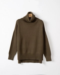 Detail view of olive green knit sweater with ribbed high neck and asymmetric split hem